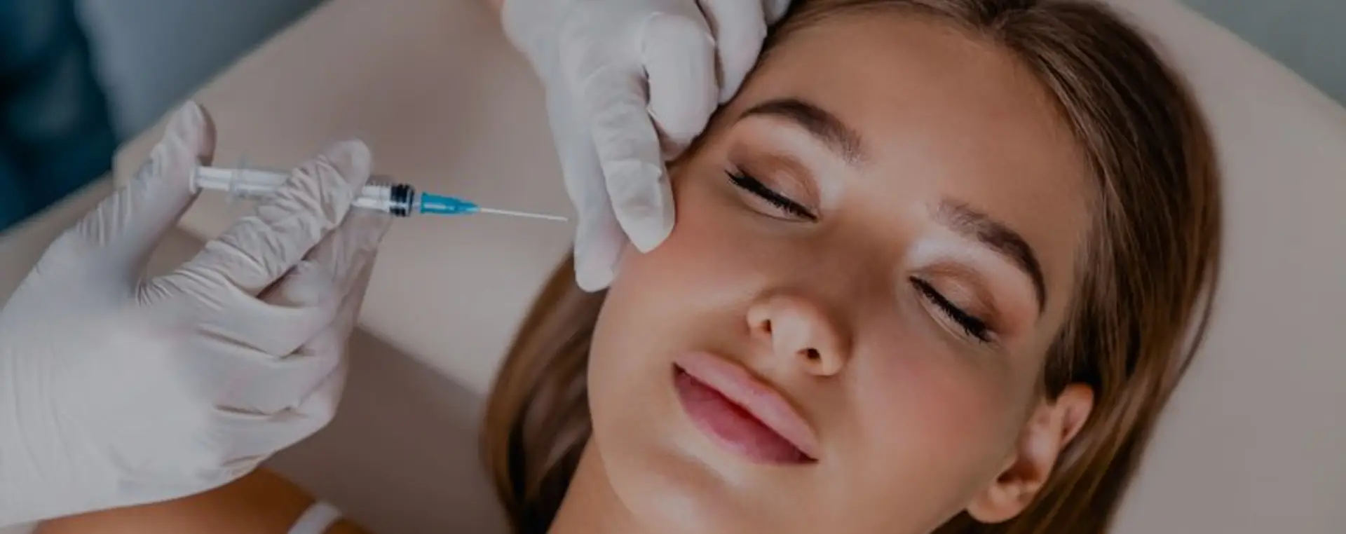 Facial aesthetic treatment being administered